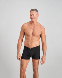 Model wears Cotton Stretch Mens Trunk in BLACK. On body front view
