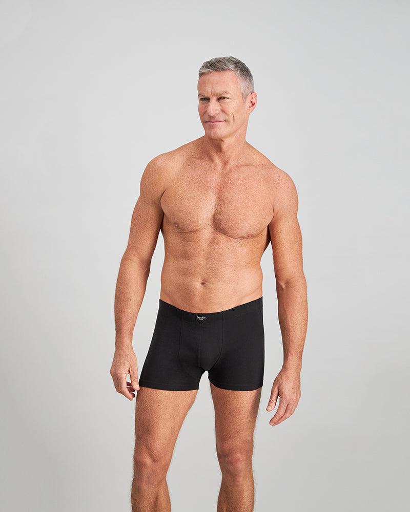 Model wears Cotton Stretch Mens Trunk in BLACK. On body front view