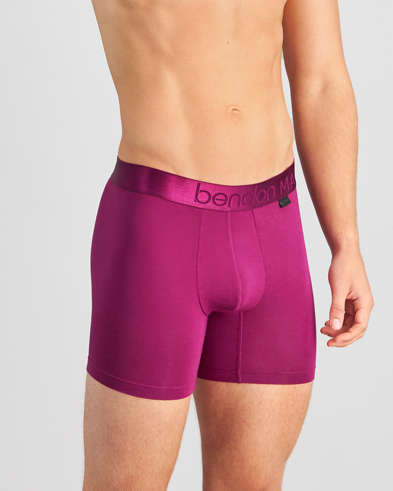 Model wears Bamboo Mens Trunk in MAGENTA PURPLE. On body side view