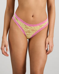 Model wears Leo Bikini in LEMON/FUCHSIA PINK. On body front view