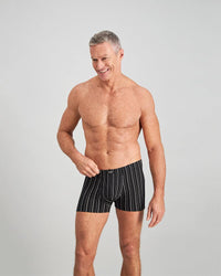 Model wears Cotton Stretch Mens Trunk in BLACK WHITE. On body front view