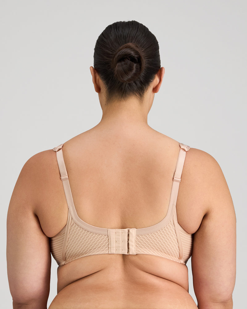 Model wears Perfect Lines Contour Bra in LATTE. On body back view
