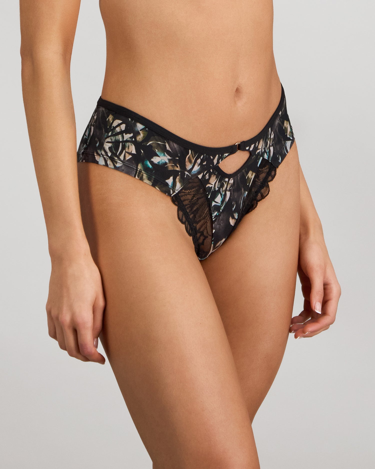 Model wears Lost Paradise Brazilian in BLACK PRINT. On body side view