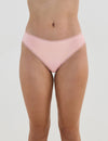 Model wears Stretch Cotton Thong in ICY PINK. On body front view