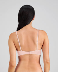 Model wears Simply Seamless Contour Bra in SILVER PINK. On body back view