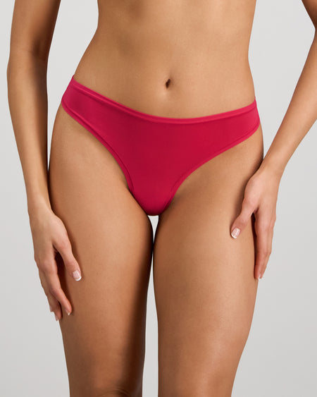 Model wears Extra-Ordinary Thong in JAZZY. On body front view
