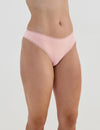 Model wears Stretch Cotton Thong in ICY PINK. On body side view