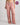 Model wears Holly Long PJ Pant in ASH ROSE. On body front view