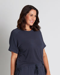 Model wears Sleep-Talk Short Sleeve Top in NIGHT SKY. On body side view
