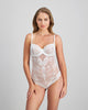 Model wears My Fit Lace Bodysuit in WHITE. On body front view