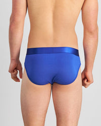 Model wears Bamboo Mens Brief in Surf The Web. On body back view