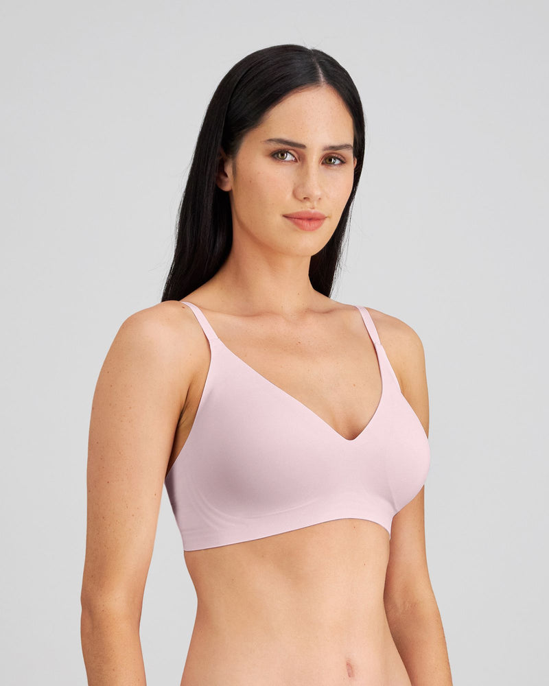 Model wears Comfit Collection Wire Free Bra in FESTIVAL BLOOM. On body side view