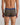 Model wears Bold Stripe Mens Trunk in BLACK/OAK BUFF STRIPE. On body back view