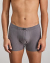 Model wears Cotton Stretch Mens Trunk in ASH PINSTRIPE. On body front view