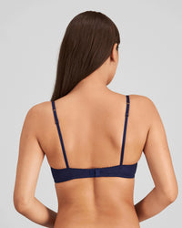 Model wears Sofia Underwire Bra in Medieval Blue. On body back view