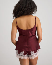 Model wears Sweet Indulgence Cami & Short Set in FIG/PALE LILAC. On body back view