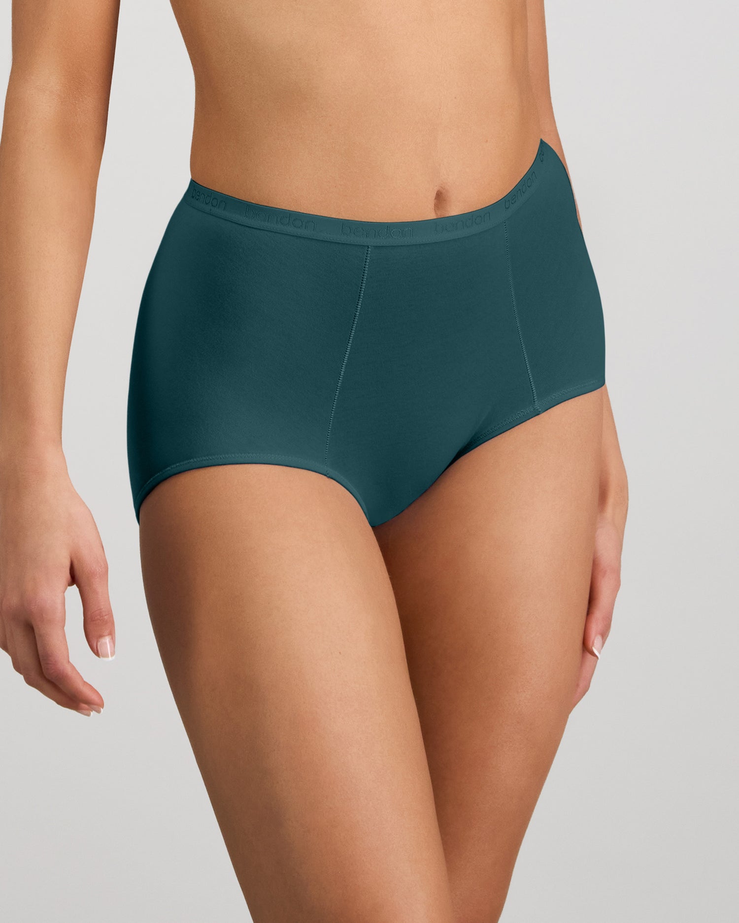 Model wears Body Cotton Full Brief in MEDITERRANEA. On body side view