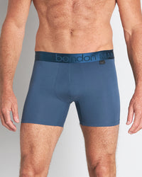 Model wears Bamboo Mens Trunk in BLUE WING TEAL. On body front view