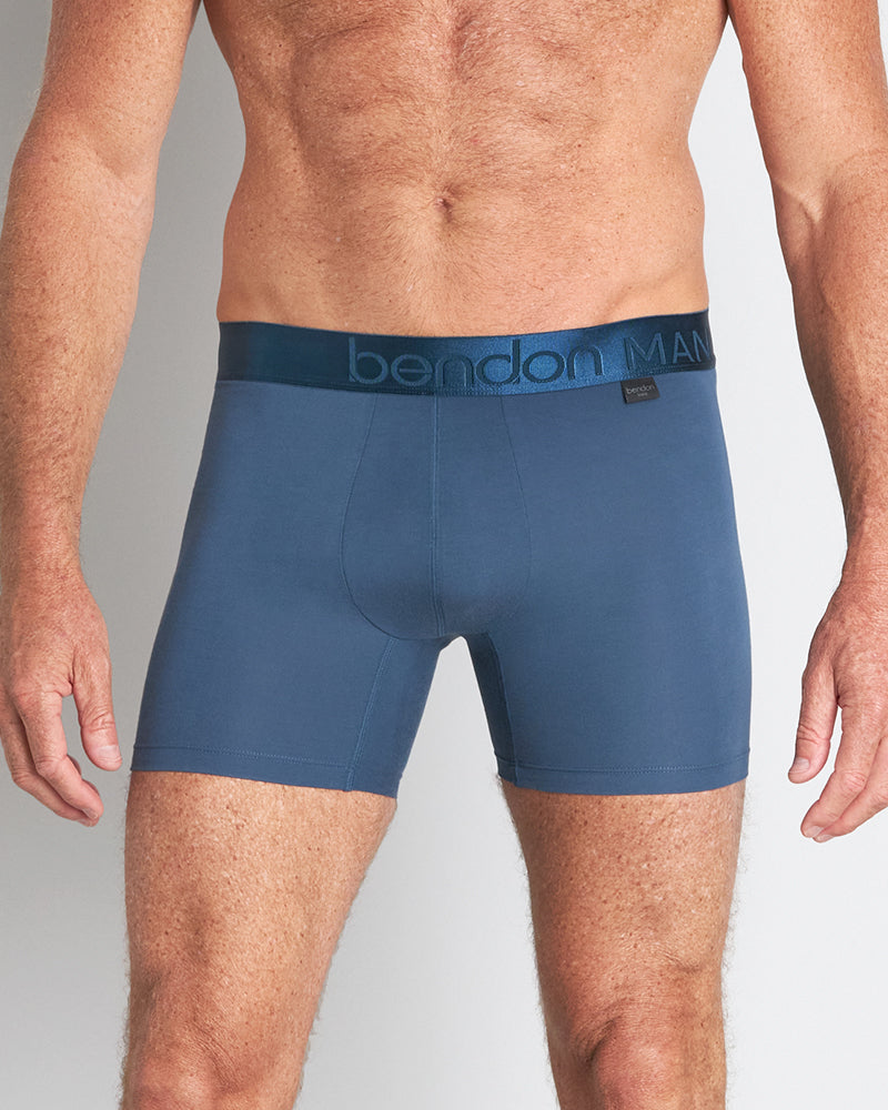 Model wears Bamboo Mens Trunk in BLUE WING TEAL. On body front view