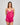 Model wears Eva Jean Short in FANTASY FUCHSIA. On body front view