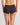 Model wears Simply Seamless Boyshort in BLACK. On body back view