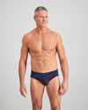 Model wears High Tech Cotton Mens Brief in PEACOAT. On body front view