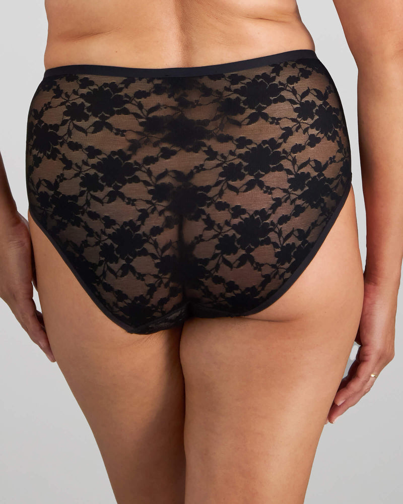 Model wears Lace Sculpt Full Brief in BLACK. On body back view