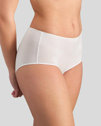 Model wears Au Naturel Full Brief in WHITE. On body side view