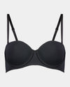 Model wears Body Basics Strapless Bra in BLACK. On body front view