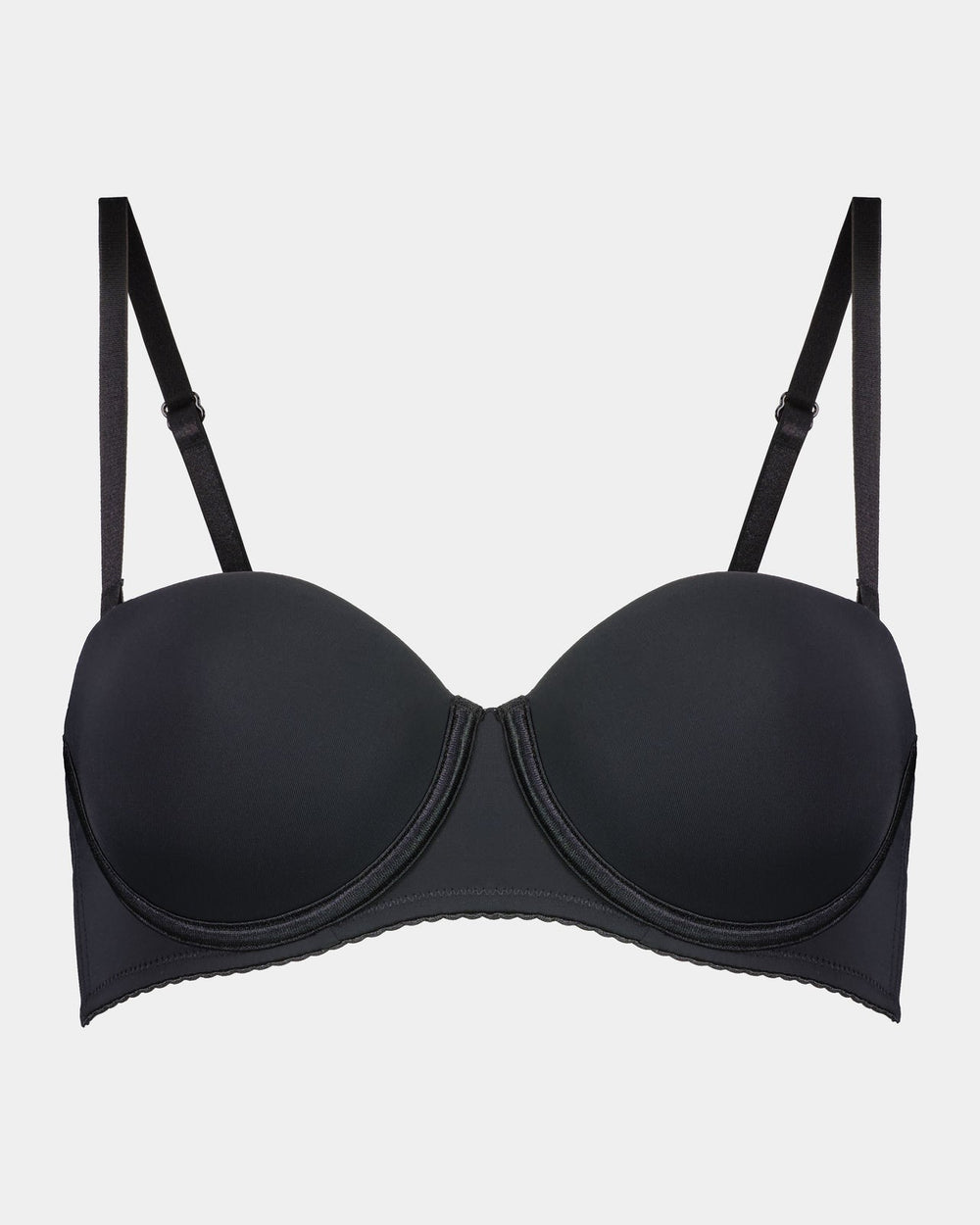 Model wears Body Basics Strapless Bra in BLACK. On body front view
