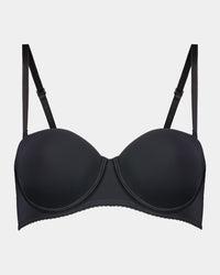 Model wears Body Basics Strapless Bra in BLACK. On body front view