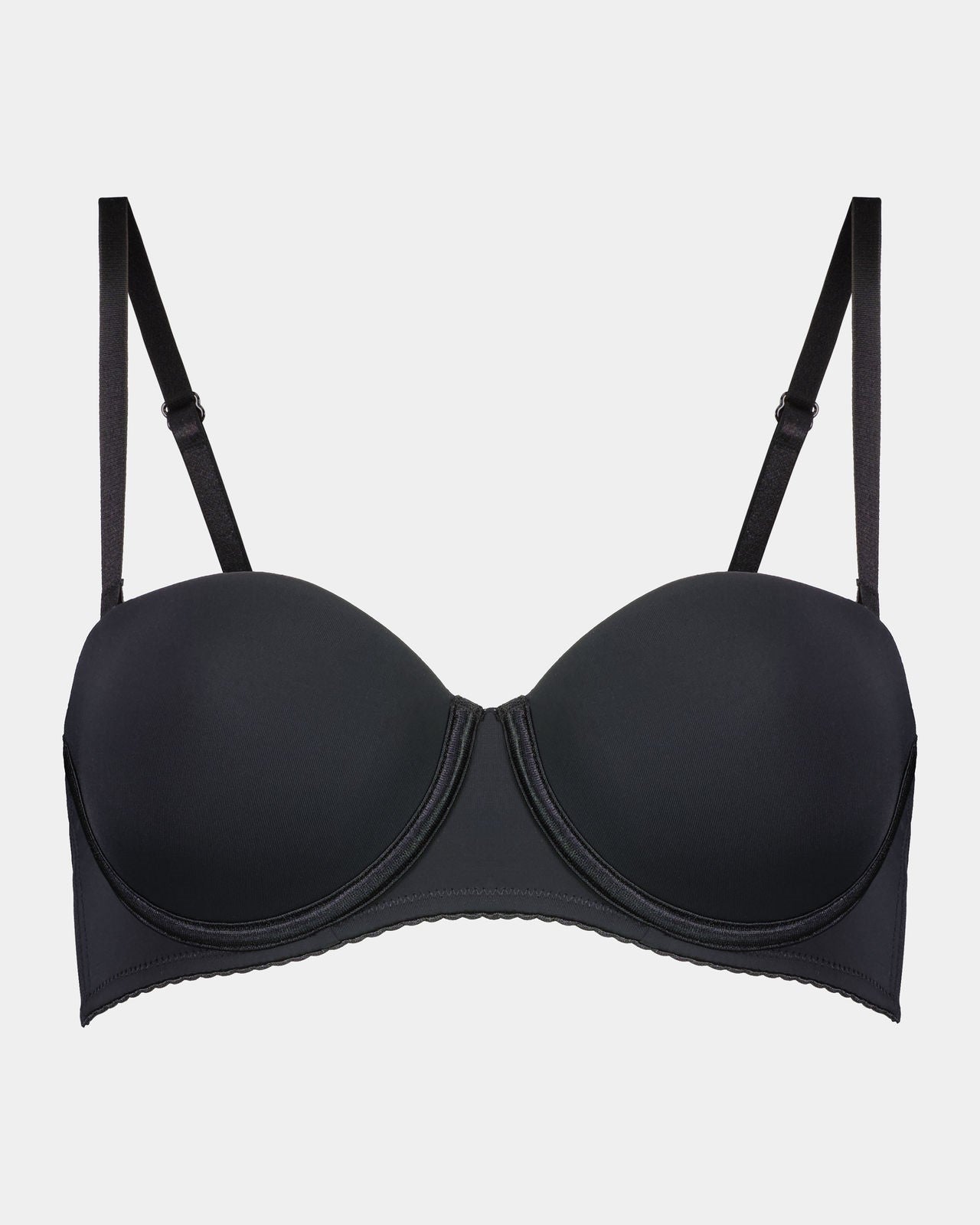 Model wears Body Basics Strapless Bra in BLACK. On body front view
