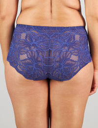 Model wears Midnight Express Full Brief in BLUE RIBBON. On body back view