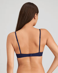 Model wears Sofia Contour Bra in Medieval Blue. On body back view