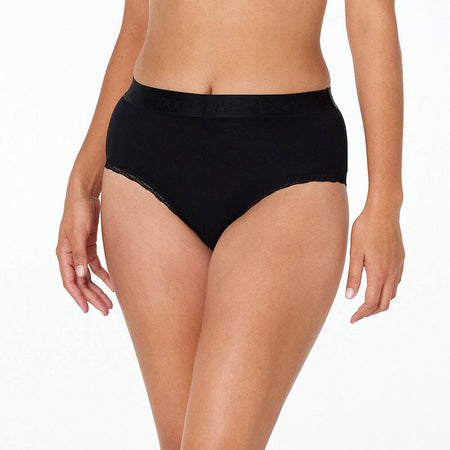 Model wears Cotton Logo Full Brief in BLACK. On body front view