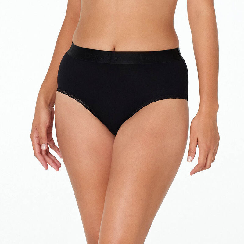 Model wears Cotton Logo Full Brief in BLACK. On body front view