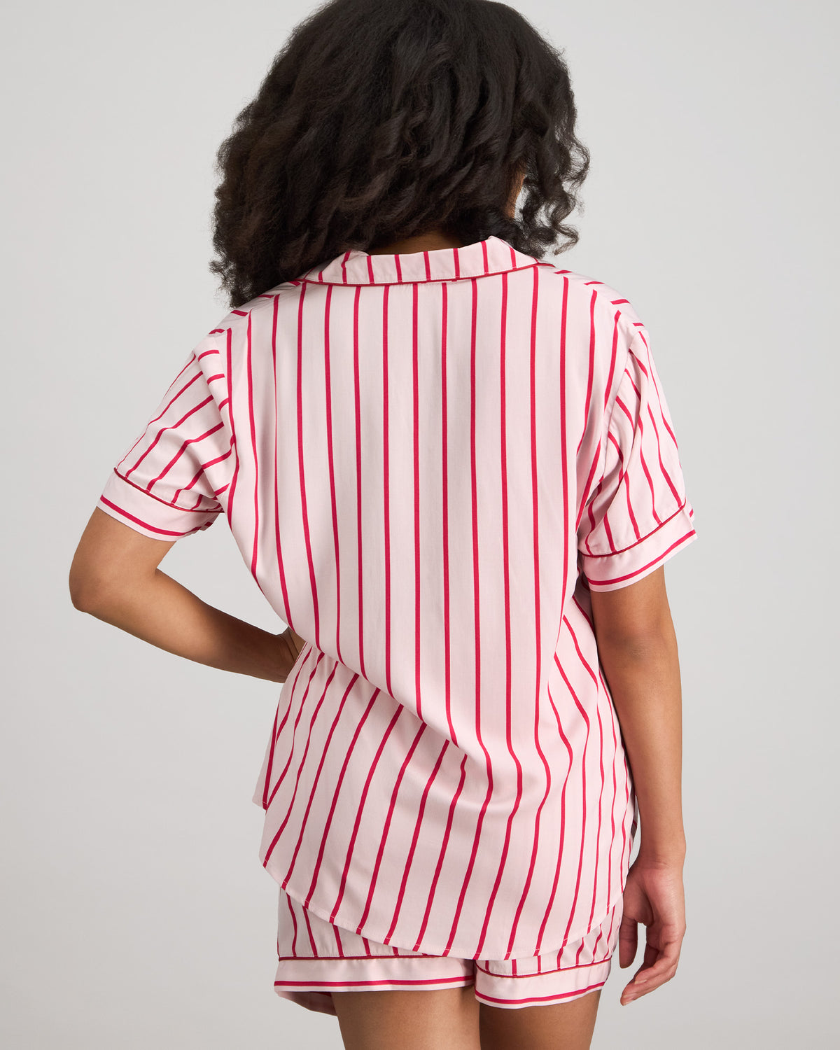 Model wears Cabana Stripe Short Pj Set in CANDY CANE. On body back view