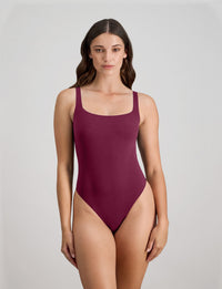 Model wears Extra-Ordinary Bodysuit in FIG. On body front view