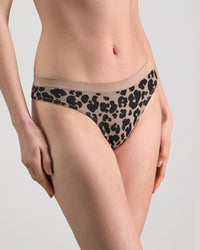 Model wears Seamless Jacquard Thong in LEOPARD LOVER. On body side view