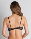 Model wears Delightfully So Underwire Bra in BLACK. On body back view