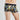 Model wears Retros Print Mens Trunk in SUMMER FOLIAGE PRINT. On body back view