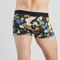 Model wears Retros Print Mens Trunk in SUMMER FOLIAGE PRINT. On body back view