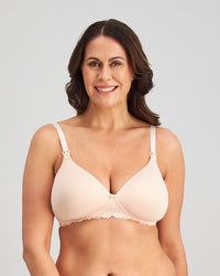 Model wears Bendon Nurture Maternity Bra in LATTE. On body front view
