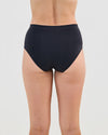 Model wears Seamless Soft Full Brief in BLACK. On body back view