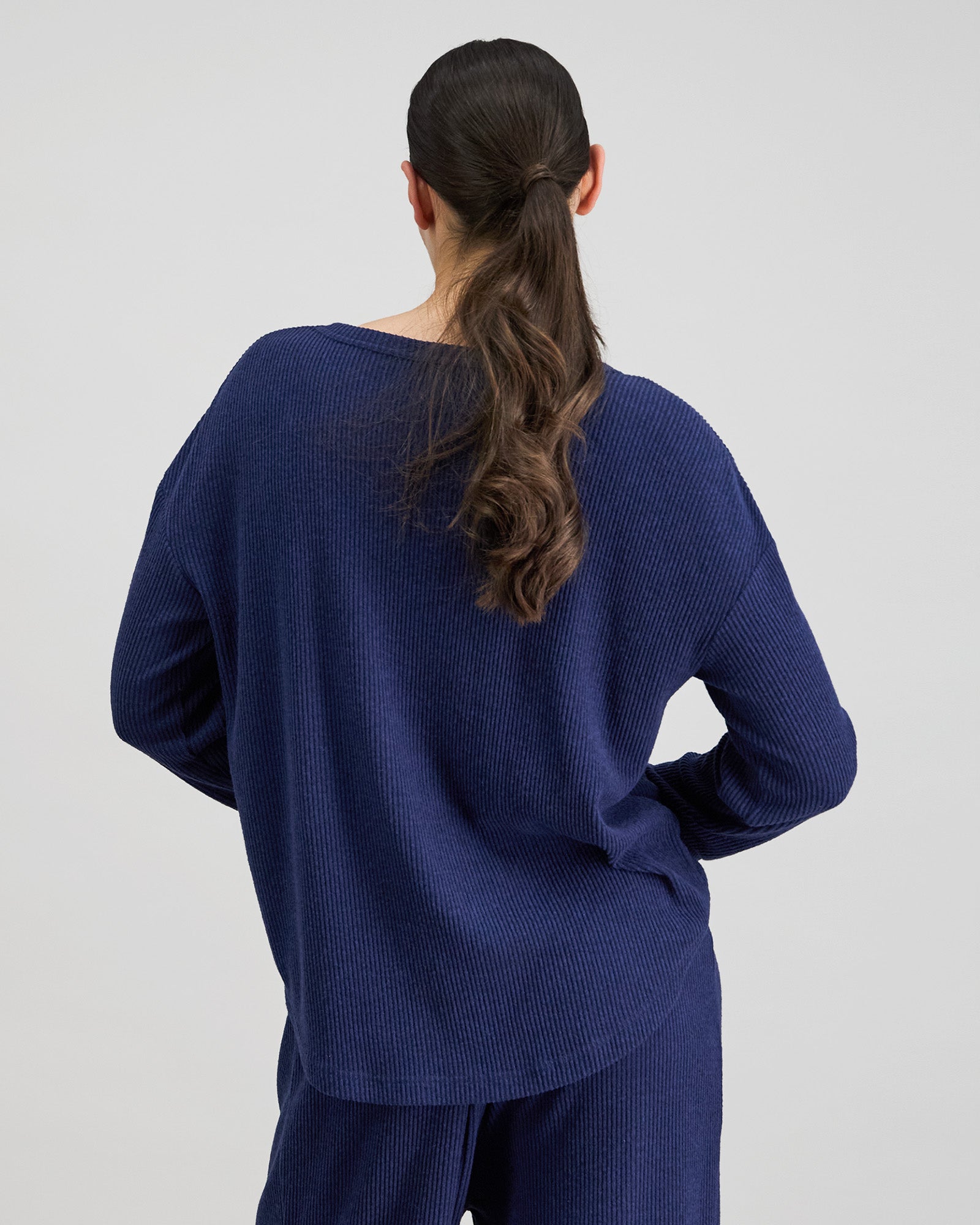 Model wears Relaxed Rib Long Sleeve Pj Top in NAVY BLAZER. On body back view
