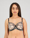 Model wears Magnetism Underwire Bra in BLACK/LATTE. On body front view