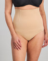 Model wears Medium Control High Waisted Brief in CARAMEL. On body front view