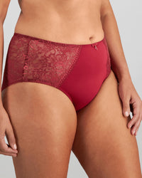 Model wears Daring Full Brief in TIBETAN RED. On body side view
