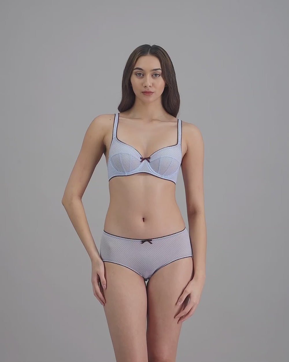 model-poses-in-light-blue-lingerie-set