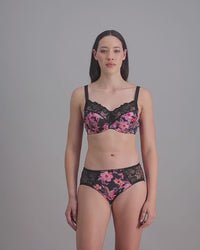 model-poses-in-floral-print-bra-and-underwear